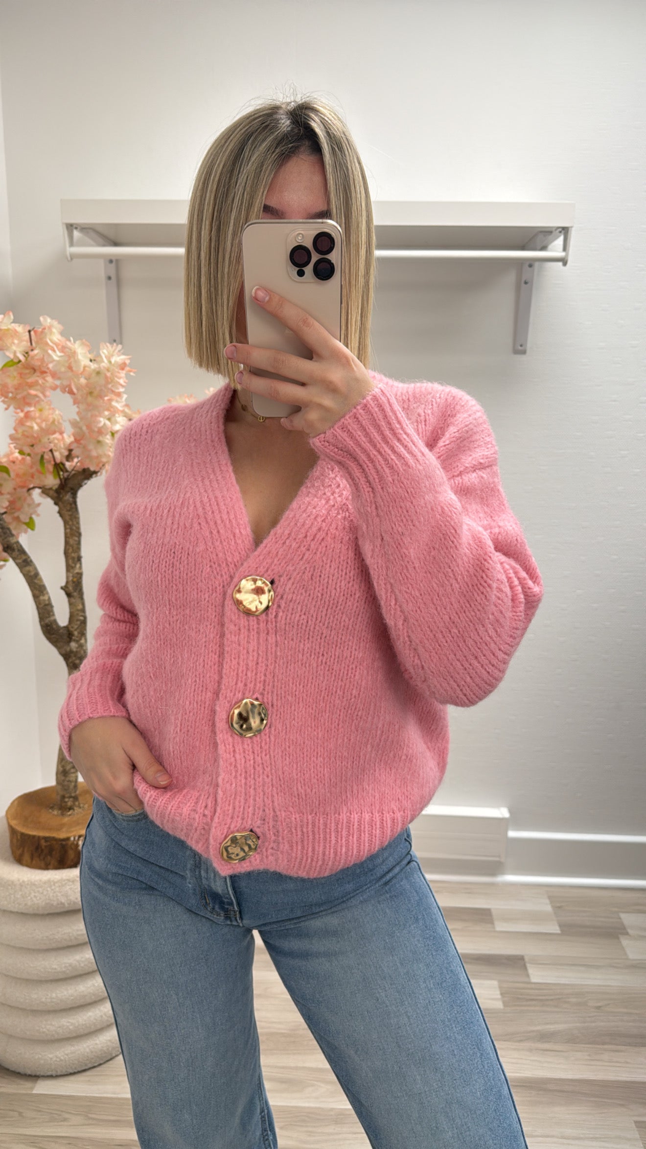 Gilet rose bouton